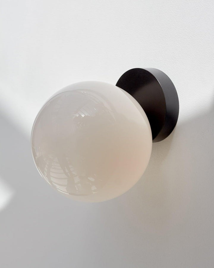 Tip of the Tongue Gold Metal Wall Sconce with White Glass Shade