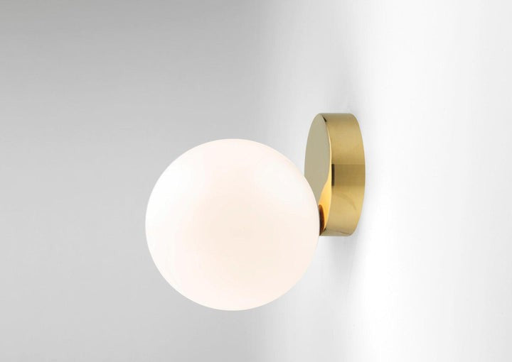 Tip of the Tongue Gold Metal Wall Sconce with White Glass Shade
