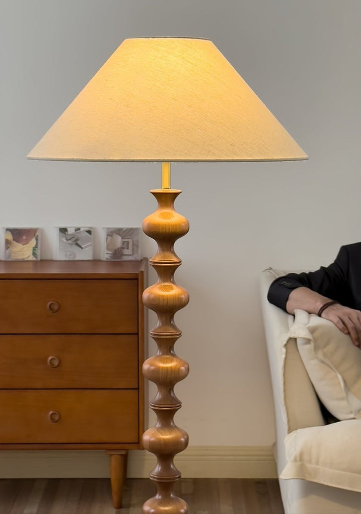Rhythmic Sculpted Wooden Floor Lamp with Pleated Shade