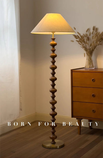 Rhythmic Sculpted Wooden Floor Lamp with Pleated Shade