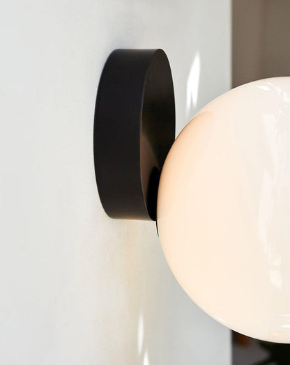 Tip of the Tongue Gold Metal Wall Sconce with White Glass Shade