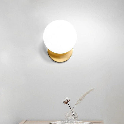Tip of the Tongue Gold Metal Wall Sconce with White Glass Shade