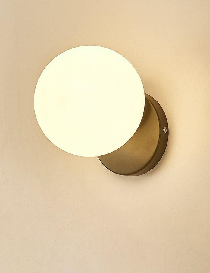 Tip of the Tongue Gold Metal Wall Sconce with White Glass Shade