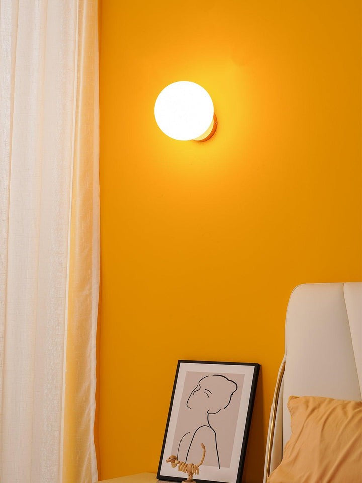 Tip of the Tongue Gold Metal Wall Sconce with White Glass Shade
