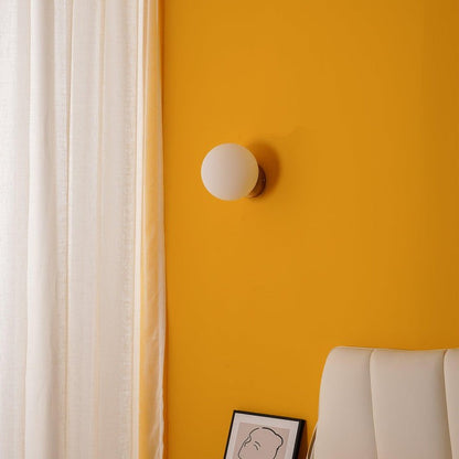 Tip of the Tongue Gold Metal Wall Sconce with White Glass Shade