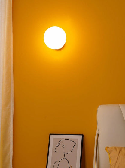 Tip of the Tongue Gold Metal Wall Sconce with White Glass Shade