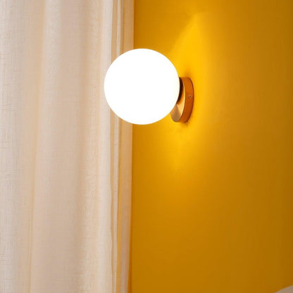 Tip of the Tongue Gold Metal Wall Sconce with White Glass Shade